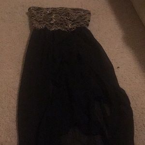 This is a black and gold party or homecoming dress